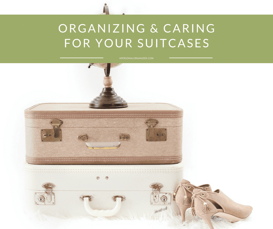 A stack of two vintage suitcases, one brown and one white, is topped with a small globe ornament. Beside the stack is a pair of beige high-heeled shoes. A green banner at the top reads "Suitcase Organizing & Caring for Your Suitcases.