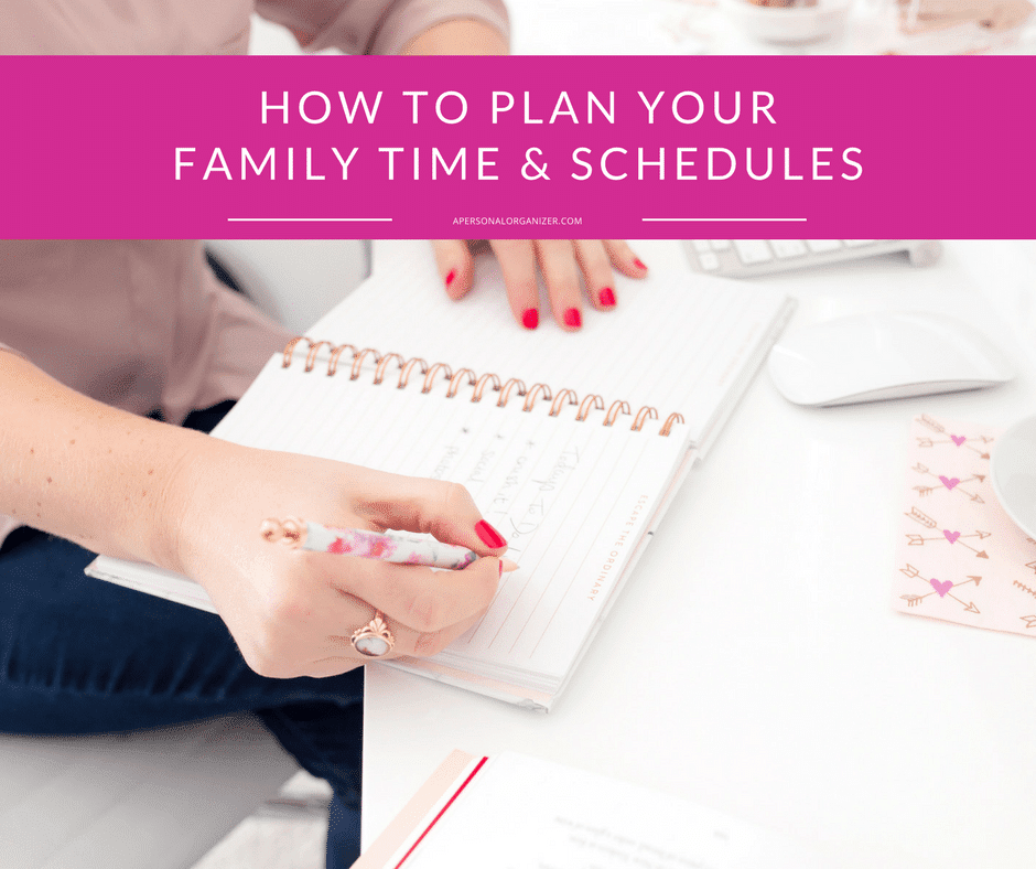 A person with red-painted nails writes in a notebook with a pink pen, planning family time and schedules. The notebook and other office supplies are neatly arranged on a white desk. At the top, a pink banner displays the text "HOW TO PLAN YOUR FAMILY TIME & SCHEDULES.