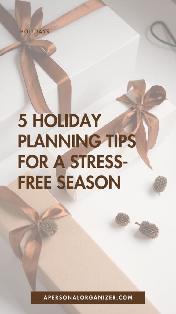 Gift boxes wrapped in white and brown paper with brown ribbons are arranged on a light surface, with small pinecones nearby. Text overlay reads: "5 Holiday Planning Tips for a Stress-Free Season. apersonalorganizer.com.