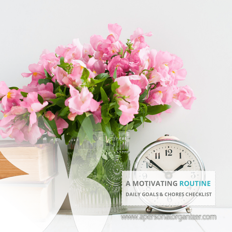 A glass vase with pink flowers sits next to a classic silver alarm clock, a stack of books, and a daily routine printable on a white surface. Text overlay reads: "A MOTIVATING ROUTINE. Daily goals & chores checklist.