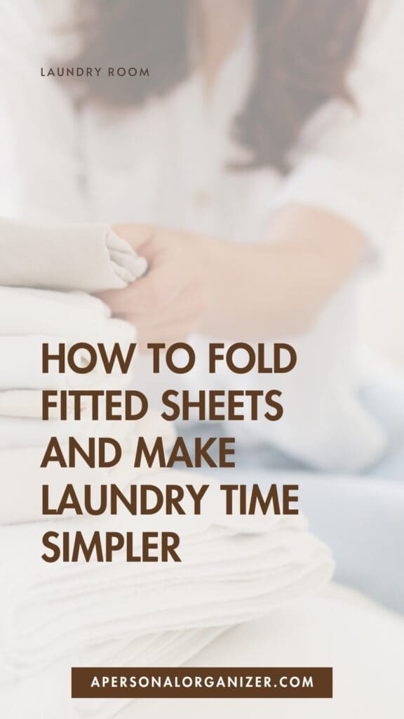 A person folding a stack of white fitted sheets, with overlaid text: "Discover how to fold fitted sheets and make laundry time simpler." The website apersonalorganizer.com appears at the bottom.