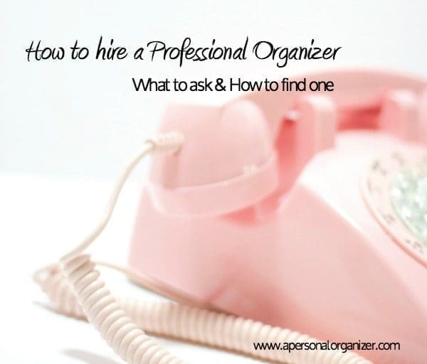 A close-up photo of a pink rotary telephone with text overlay reading "How to hire a Professional Organizer: What to ask & How to find one." The website address "www.apersonalorganizer.com" is visible at the bottom right corner.