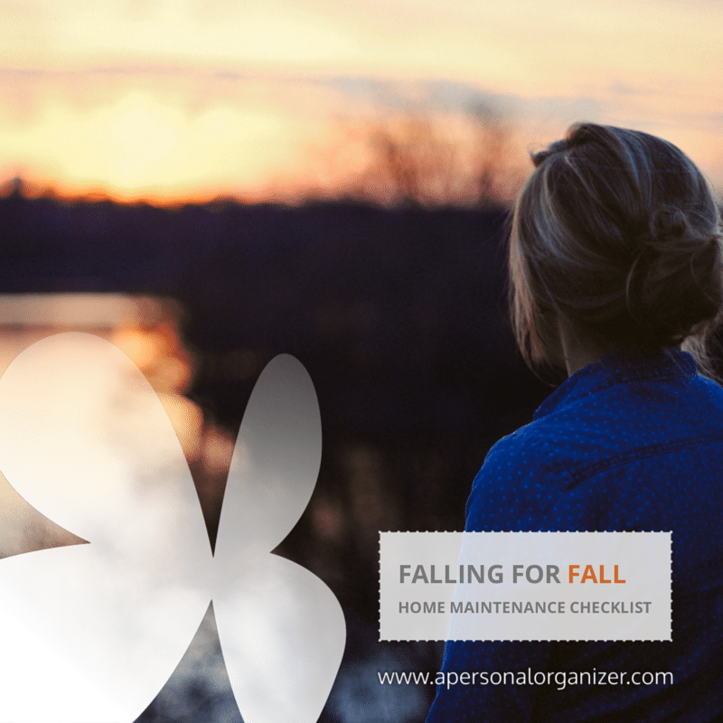 A woman with her back to the camera watches a sunset over a body of water. The text on the image reads "Falling for Fall: Home Maintenance Checklist" and "www.apersonalorganizer.com" is at the bottom. Don't miss out on our essential fall checklist!