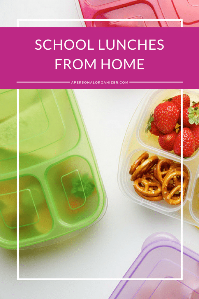Three colorful lunch containers with various snacks inside. One container holds fresh strawberries and pretzels. The image is topped with a pink banner that reads "School Lunches From Home" and a website link "apersonalorganizer.com." Perfect for easy school lunches!