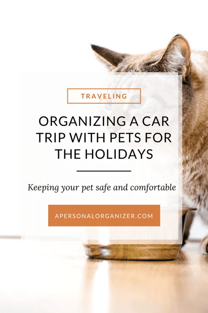 A cat in the background with text overlay that reads "Traveling With Your Pet: Organizing a Car Trip for the Holidays. Keeping your pet safe and comfortable." apersonalorganizer.com.