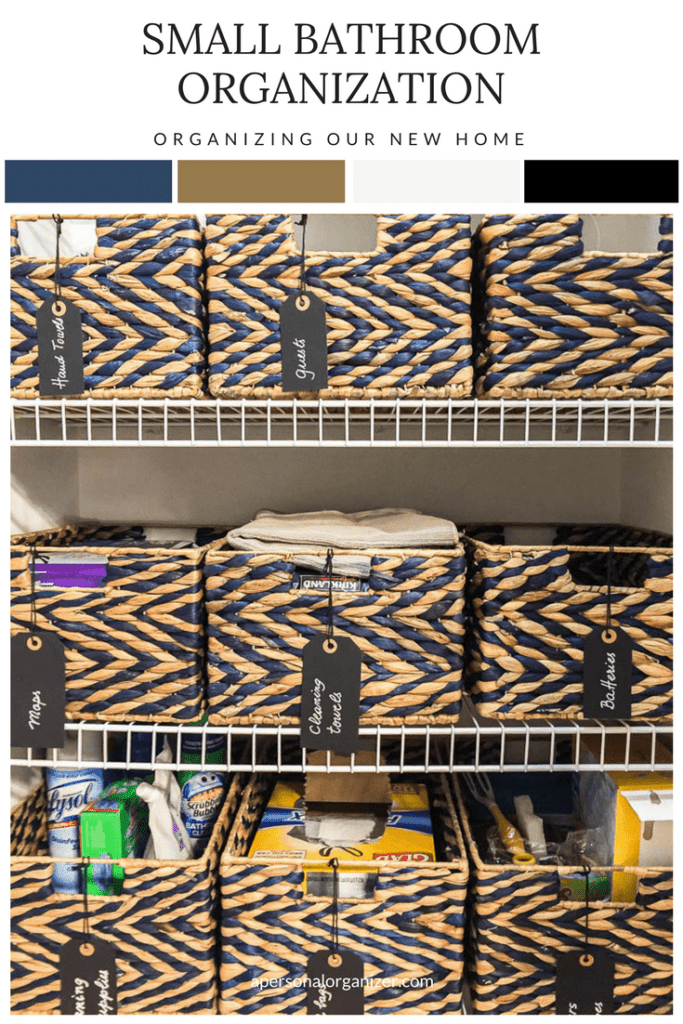 Image of neatly organized baskets on white wire shelves in a small bathroom. Each basket is labeled with a black tag indicating contents like "Hand Towels," "Gifts," "Cleaning Supplies," and "Body Wash." The blog title reads "Small Bathroom Organization: Maximizing Space Efficiently.
