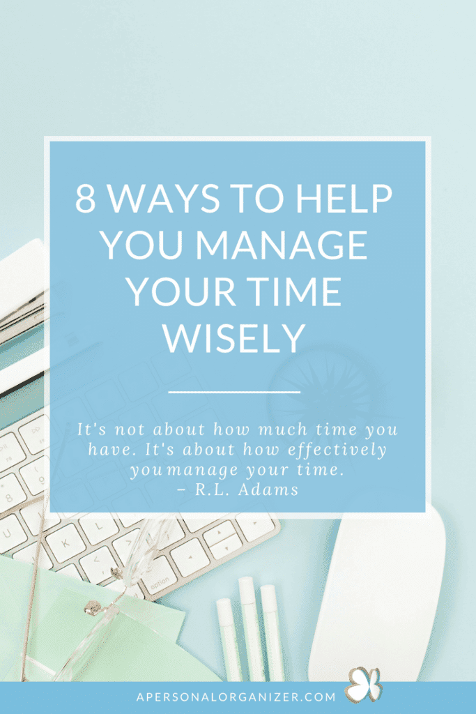 A neatly arranged flat lay includes a white keyboard, notebook, pen, clipboard, glasses, green scissors, and earbuds set against a light blue background. A central text box reads, “8 Ways to Manage Your Time Wisely” with a quote by R.L. Adams below.