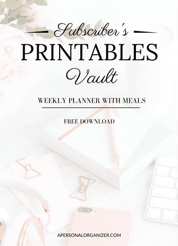 A promotional graphic featuring "Subscriber’s Printables Vault, Weekly Planner With Meals, Free Download" atop a soft pastel desktop with office supplies and flowers, highlighting free printables from apersonalorganizer.com.