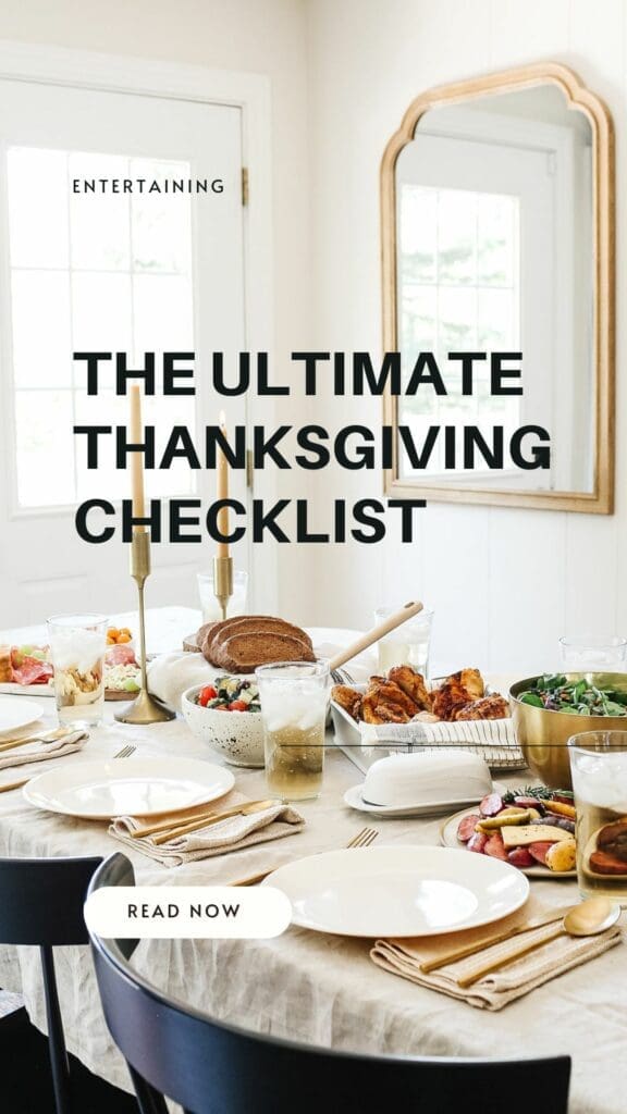 A dining table is festively set for Thanksgiving with plates, glasses, cutlery, and delicious dishes including bread and vegetables. A large mirror beautifully reflects a window. Text reads "The Ultimate Thanksgiving Checklist" and "Read Now.