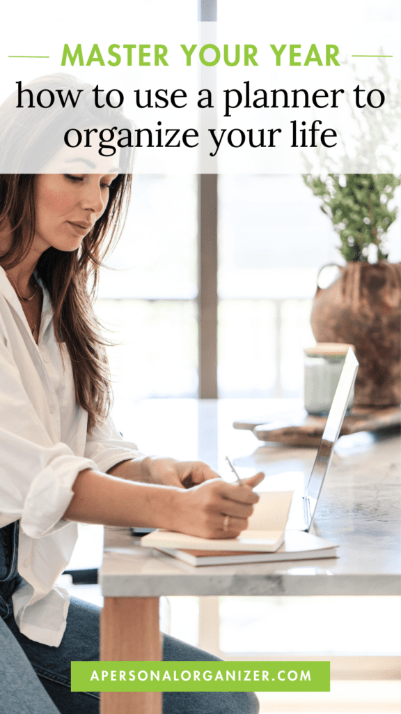 A woman sits at a table, writing in a planner with her laptop open beside her. Text on the image reads, "Master Your Year: discover how a planner can organize your life." A website link is at the bottom.