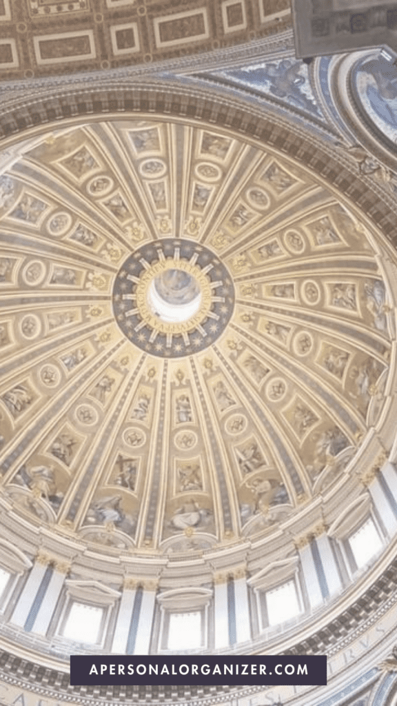 A close-up of the intricate ceiling of St. Peter's Basilica in Rome, highlighting the cultural and religious sites to visit and how to dress respectfully.