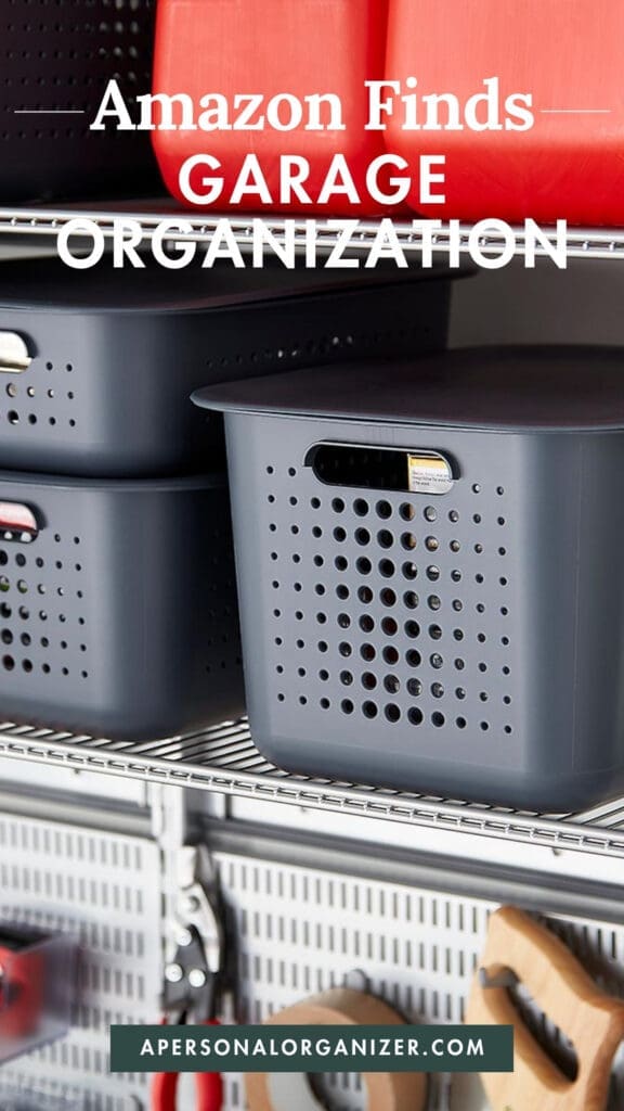 Plastic storage bins are stacked on metal shelves above wall-mounted hooks holding tools. Text reads “Amazon Garage Organization Finds” and “apersonalorganizer.com.”.