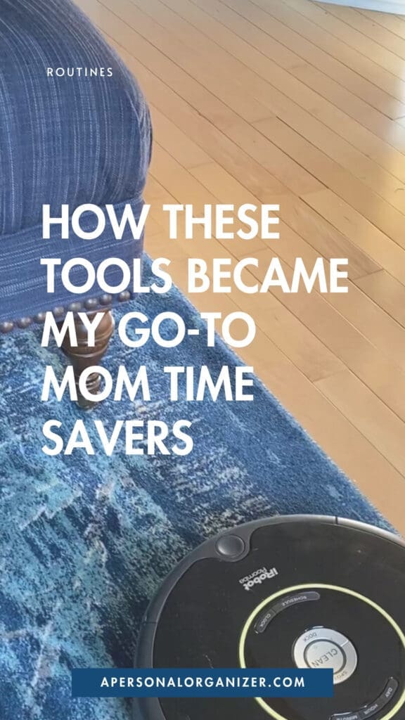 A robotic vacuum cleans a hardwood floor near a blue rug and couch. Overlaid text reads, “How these tools became my go-to time saving hacks for moms.” Website: apersonalorganizer.com.