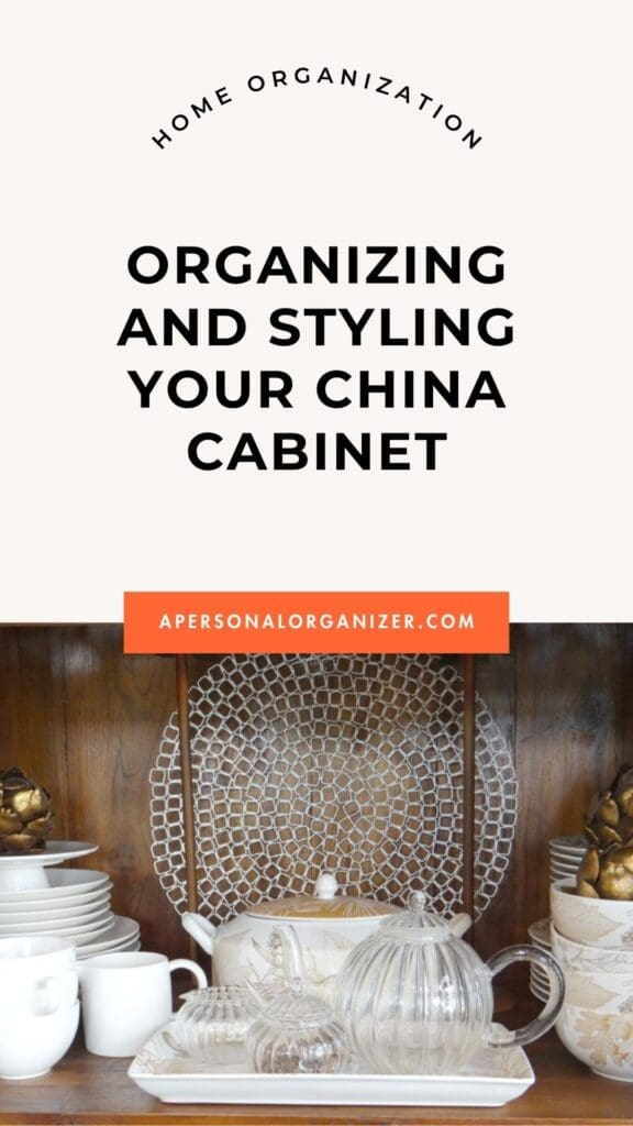 A neatly arranged china cabinet with plates, teapots, cups, and decorative items, shown below the text “Organizing and Styling Your China Cabinet” and “apersonalorganizer.com.”.