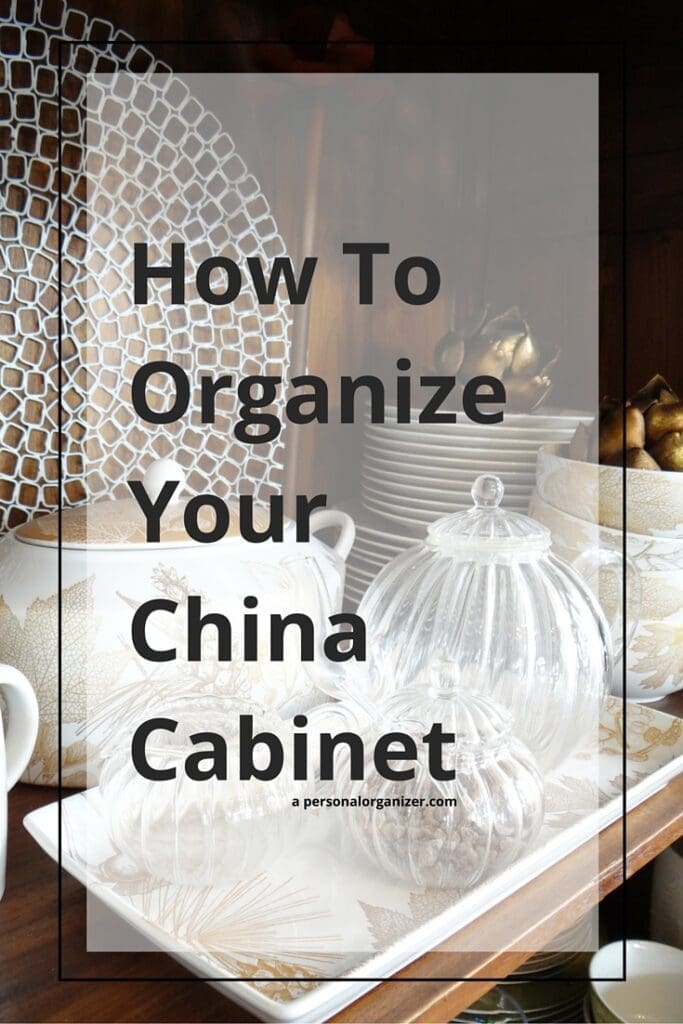 Assorted china dishes and jars in a neatly arranged cabinet, with text overlay reading "How To Organize Your China Cabinet" in bold letters.