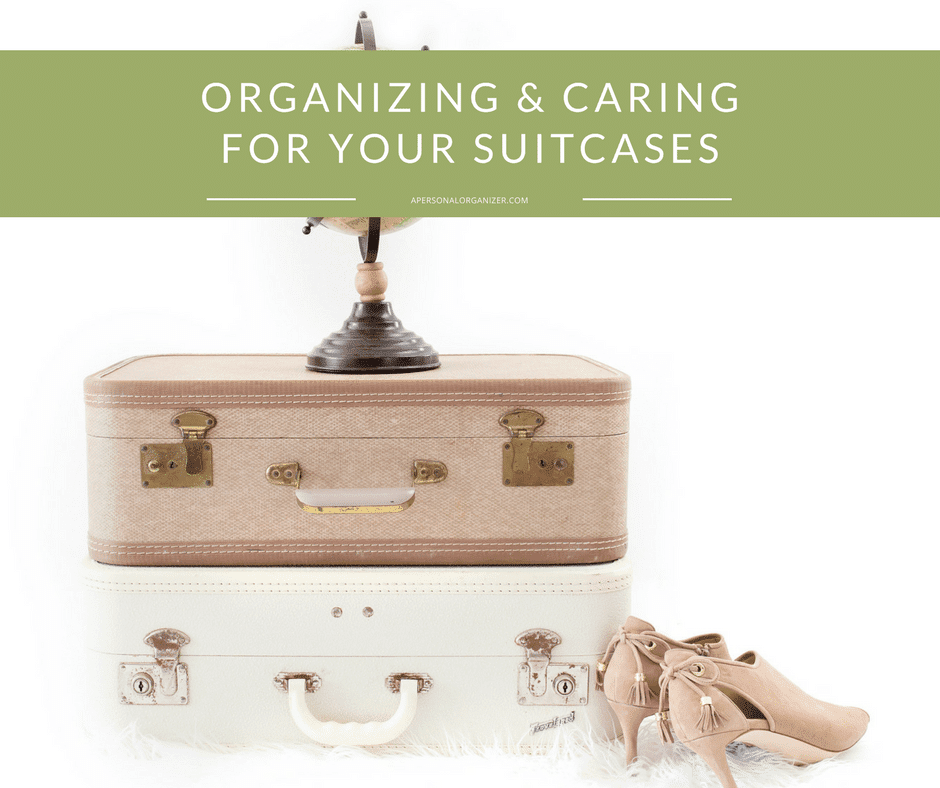 A stack of two vintage suitcases, one brown and one white, is topped with a small globe ornament. Beside the stack is a pair of beige high-heeled shoes. A green banner at the top reads "Suitcase Organizing & Caring for Your Suitcases.