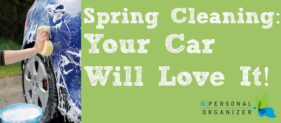 A person's hand is using a sponge to wash a car with soap, next to a blue bucket of soapy water. Text on the right reads "Spring Cleaning: Your Car Will Love It!" followed by the logo "a Personal Organizer.