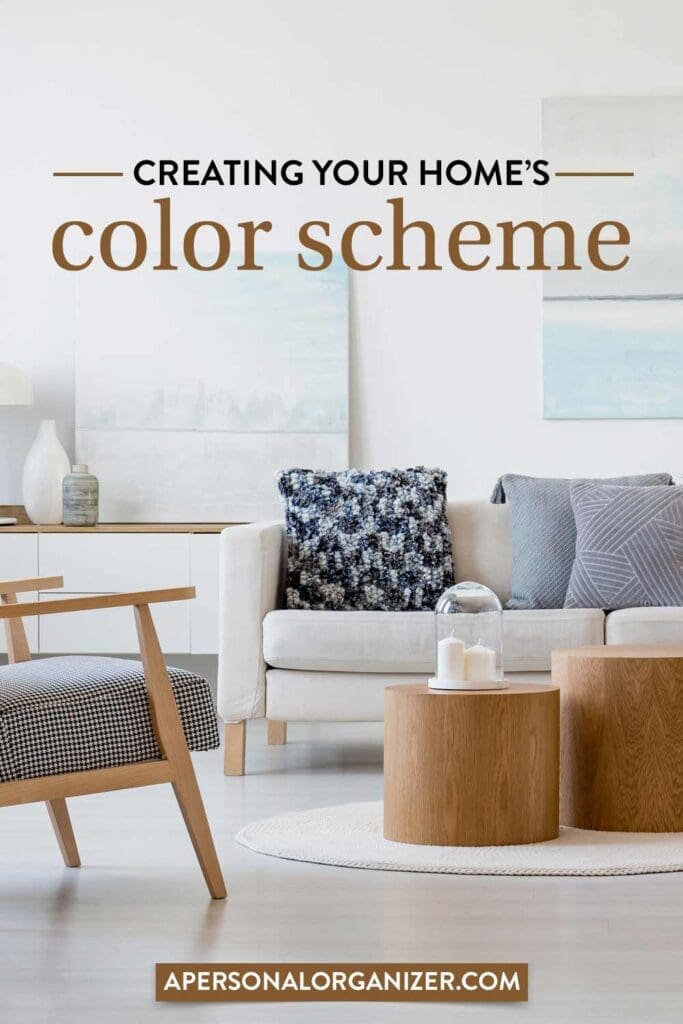 A modern small living room with a neutral color palette features a light sofa adorned with patterned pillows, wooden circular tables, and minimalist decorations. Text overlay reads "Creating Your Home's Color Scheme" with a website link at the bottom.