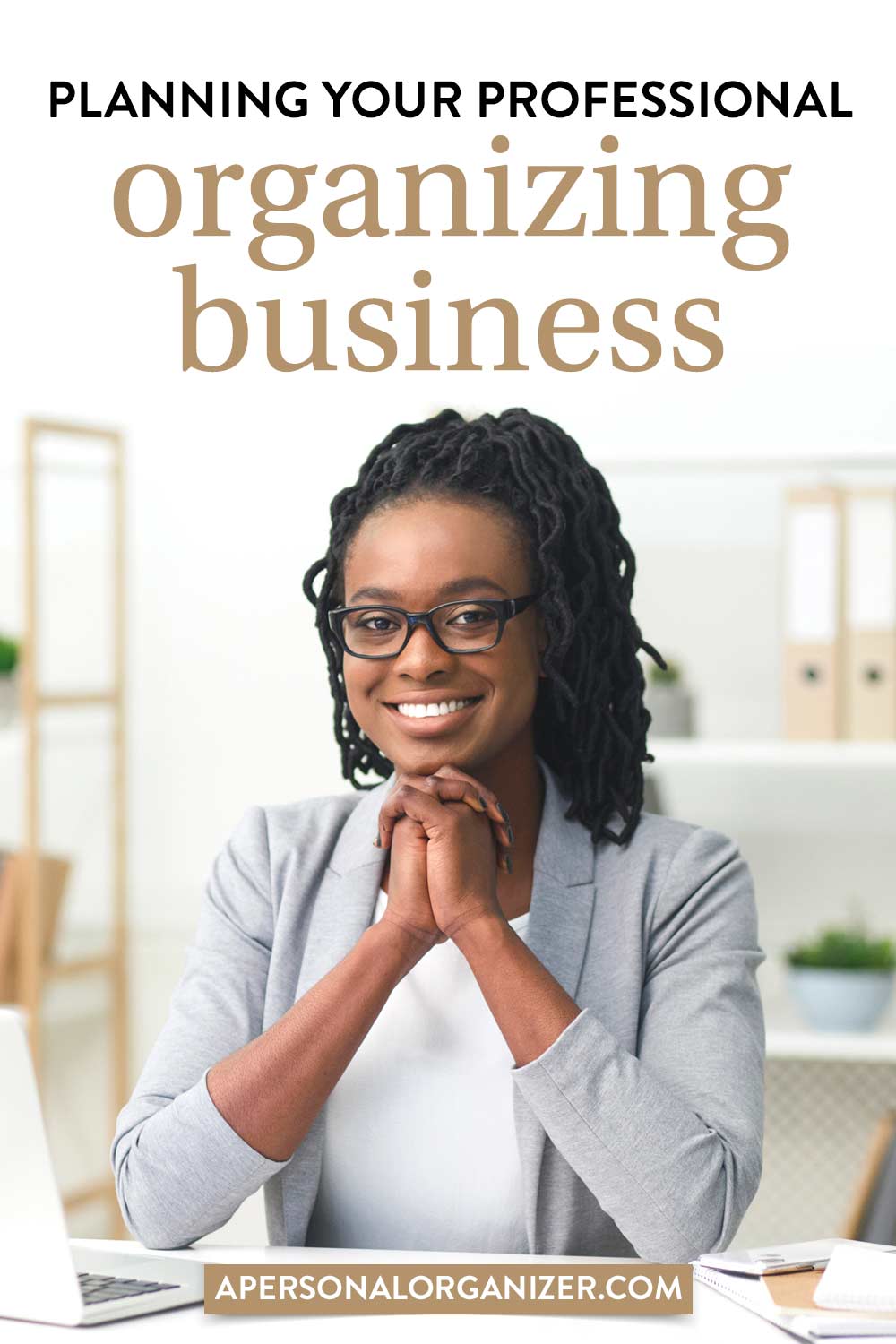 A smiling person with glasses and dreadlocks sits at a desk in an office. The text reads, "Planning Your Professional Organizing Business" and "apersonalorganizer.com." Shelves with office supplies highlight clever solutions for small living, ensuring even compact spaces are efficiently utilized.