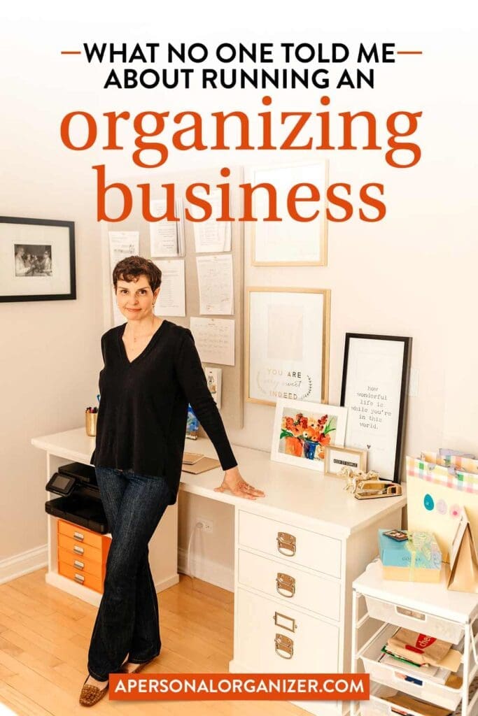 A person stands in a neatly organized office space, smiling at the camera. The room, which proves that even small living areas can be tidy, has framed photos on the walls and various office supplies. Text reads: "What no one told me about running an organizing business" with a website link.