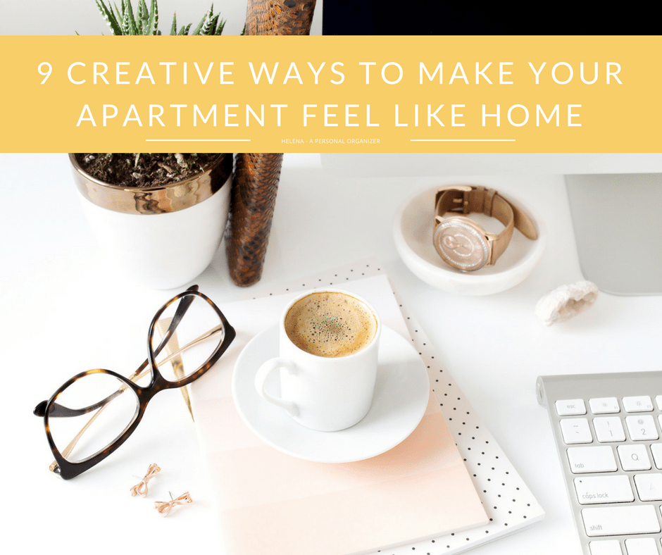 A stylish workspace featuring a coffee cup on a white saucer, a pair of glasses, a notebook, and a keyboard. The background shows an apartment-friendly plant and a basket. Overlay text reads "9 Creative Ways to Make Your Apartment Feel Like Home.