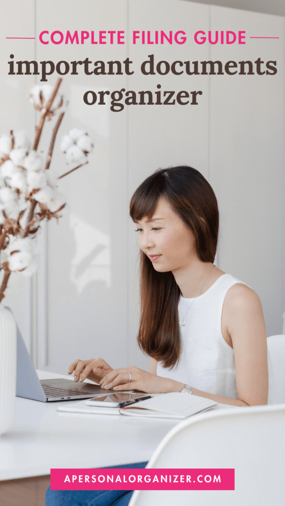 A woman in a white sleeveless top sits at a table using a laptop. The room is bright with a cotton plant nearby. Text above reads "Complete Filing Guide: Important Document Organizer" for an efficient filing system. A website link is displayed below.